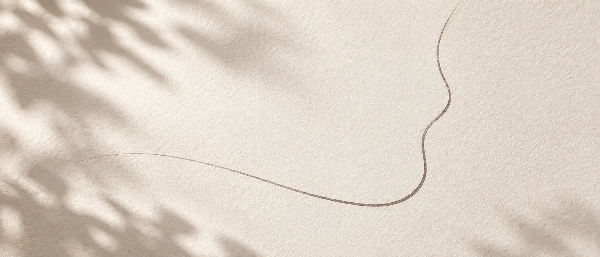 A simple curved outline drawn on paper