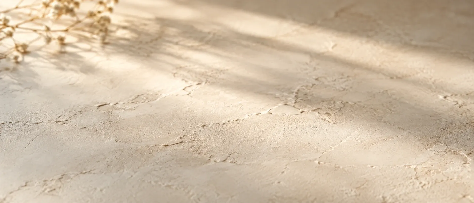 A pale textured surface in soft light
