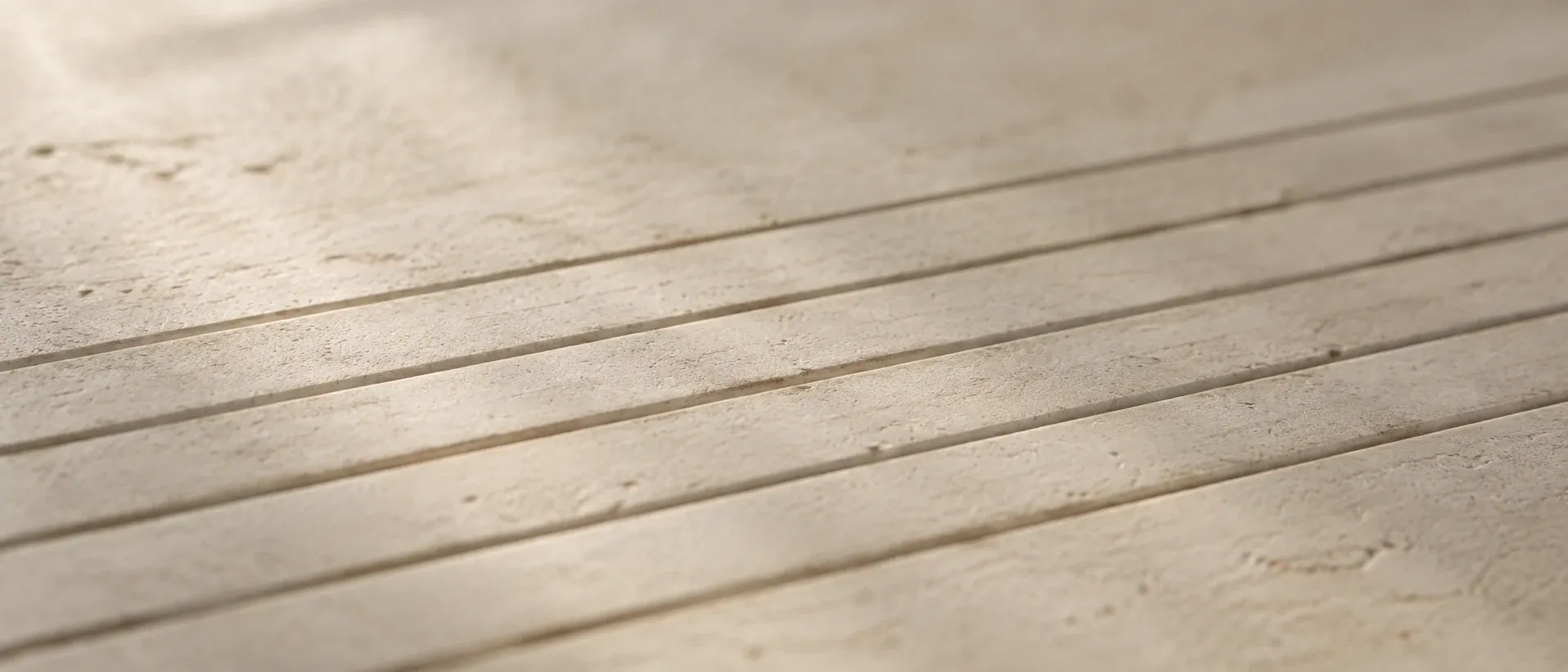 Evenly spaced marks on a pale surface