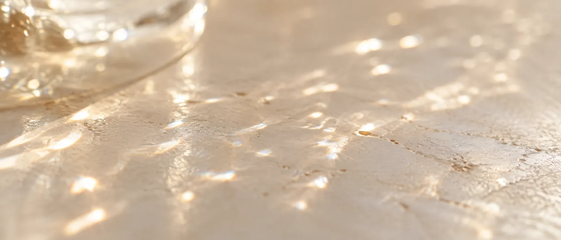 Fine scattered particles of light on a pale surface