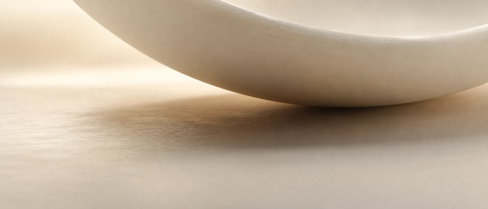 Soft shadow falling across a pale surface